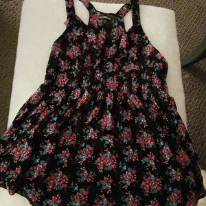 Fun pops of flowers on black tank